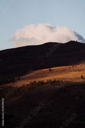 Large puffy cloud in dramatic landscape photo