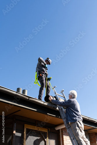 Wallpaper Mural Worker Securing Rooftop Safety Harness Torontodigital.ca