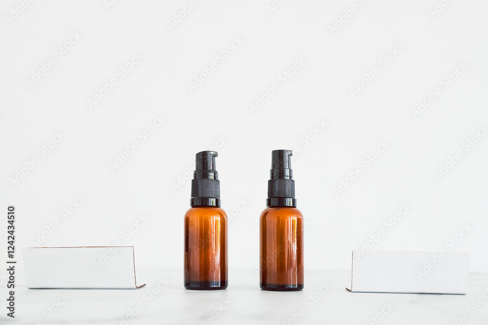 apothecary amber style moisturizer bottles next to blank labels with copy space on minimalistic white marble apothecary amber style moisturizer bottles next to blank labels with copy space on minimalistic white marble