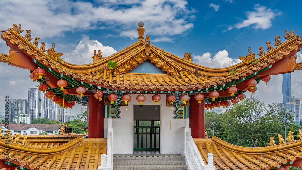 Beautiful Chinese pagoda. Bright tiled roofs with curved eaves. Rows of red traditional lanterns are suspended along the edges. Staircase with carved stone handrails. Skyscrapers in the distance. Beautiful Chinese pagoda. Bright tiled roofs with curved eaves. Rows of red traditional lanterns are suspended along the edges. Staircase with carved stone handrails. Skyscrapers in the distance.