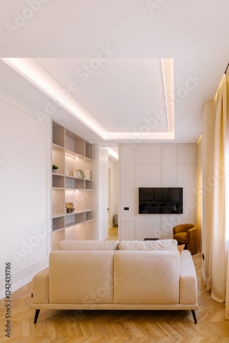 Cozy modern living room with sofa and wall-mounted TV
