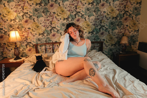 Tattooed girl in vintage bedroom