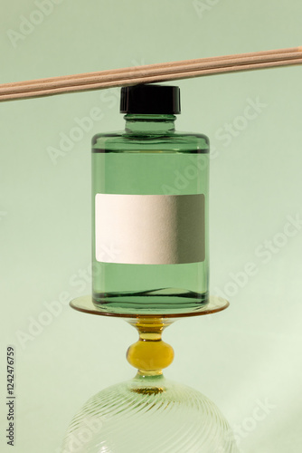 Elegant product mockup featuring a green bottle on a stand