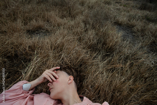 A woman lying on the grass  photo