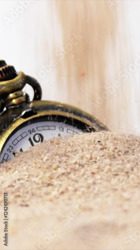 Alarm clock in sand