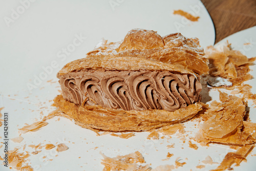 a piece of cake on a white paper box photo