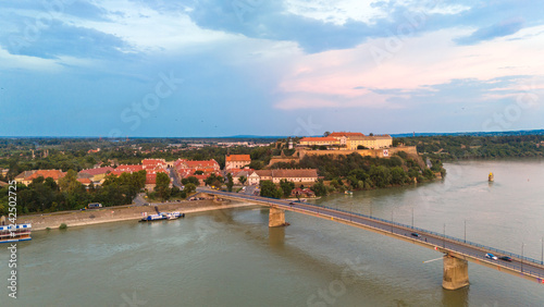 Aerial view of Petrovaradin fortress Danube river and bridge in Novi Sad Serbia during sunset