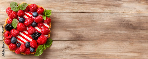 Decadent berry tart topped with fresh raspberries, blueberries, and mint