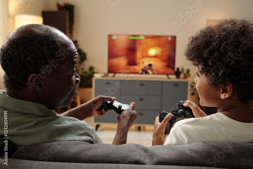 Foto Elderly Black Man Playing Video Games with Child