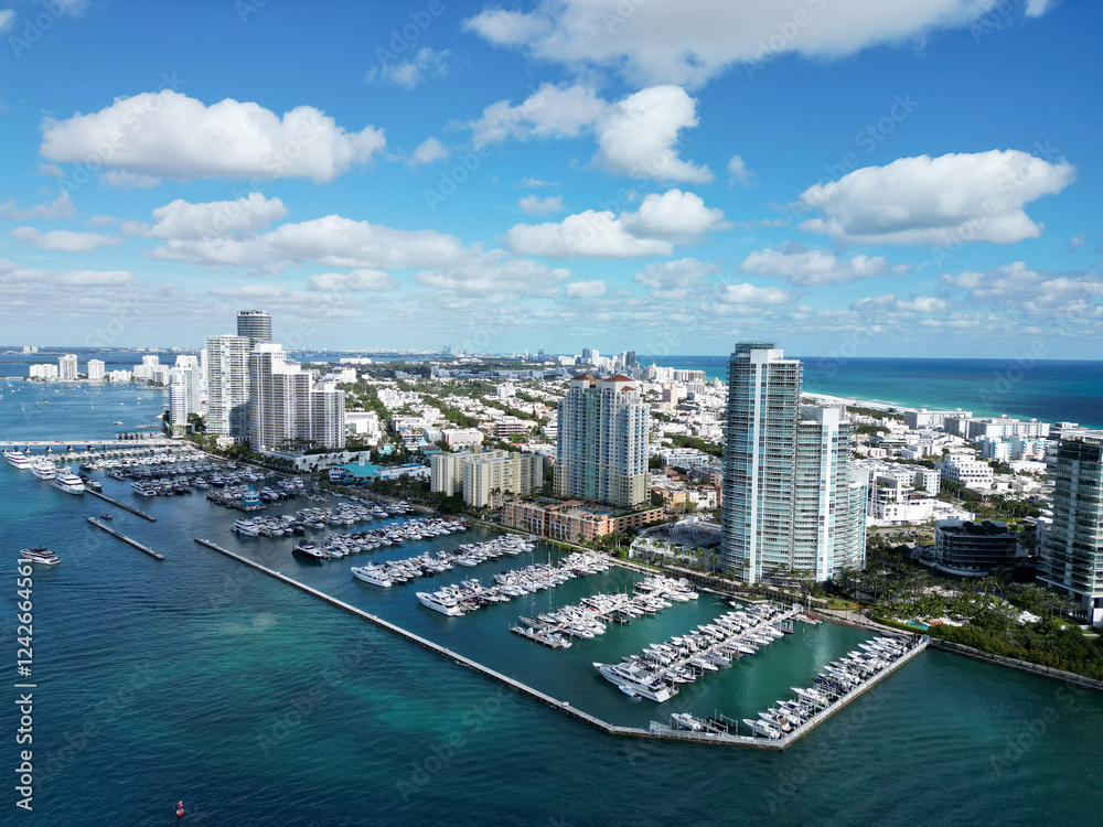 Fototapeta premium Miami south beach view. Yacht club. Marina in Miami, Florida. Luxury yachts. Miami marina with luxury yacht. Summer vacation. Luxury South beach marina. Luxury yacht. Private marina slips