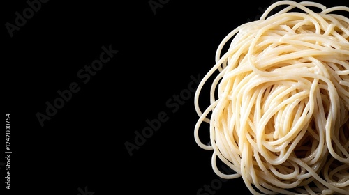 Cooked spaghetti on black background, food photography photo