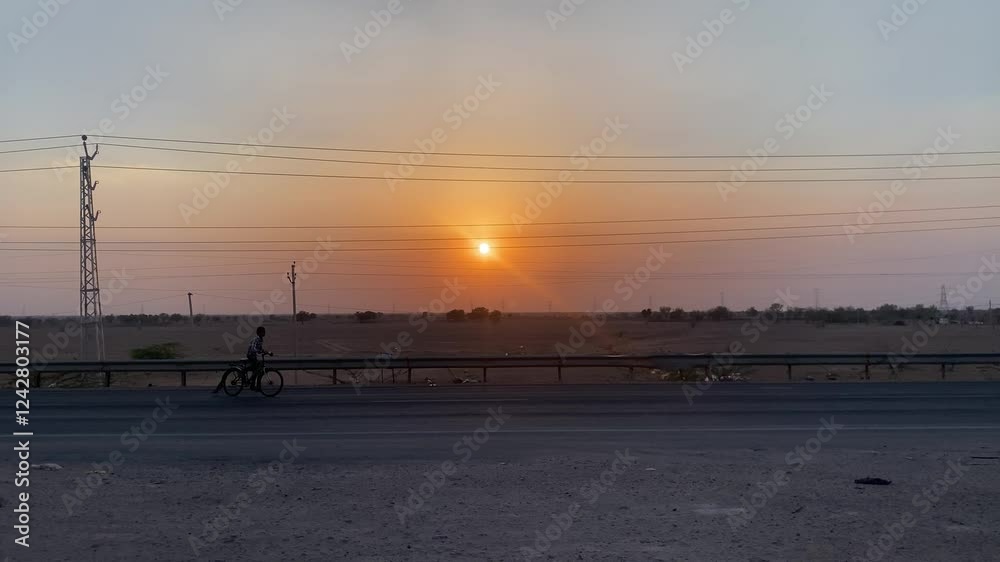 Jodhpur, India - Feb 2, 2025: - muslim couple going on a bike at sunrise time, Muslim couple on bike, Beautiful sunrise view Jodhpur, India - Feb 2, 2025: - muslim couple going on a bike at sunrise time, Muslim couple on bike, Beautiful sunrise view