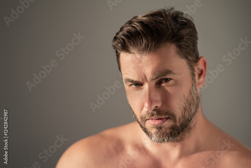 Close up portrait of handsome man. Portrait of shirtless man for skincare and beauty concepts. Handsome man with beauty face, facial skin portrait. Male healthy skin and spa concept.