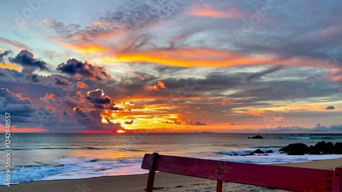 Serene Sunset at the Beach: A Red Bench Awaits