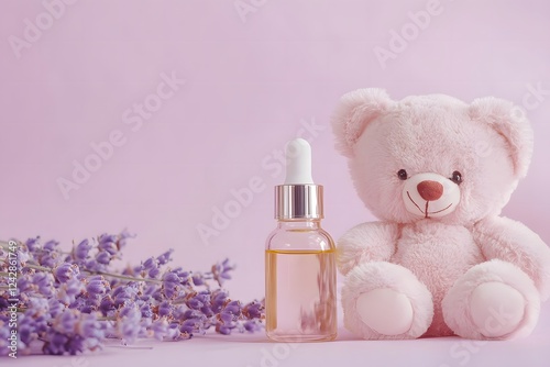 A pastel lavender background featuring a baby oil bottle next to a soft plush teddy. Copy space available . Concept of baby care products .


