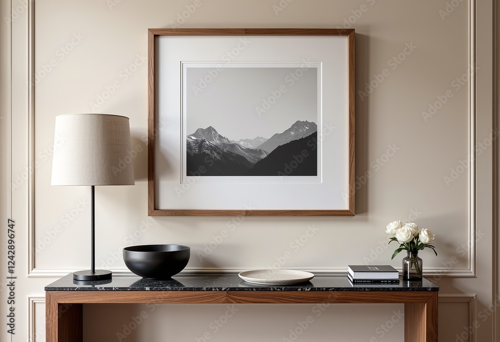 Obraz premium Framed Landscape Photo Above Console Table: Neutral Tones, Wood & Marble Accents, Scandinavian Decor, Bowl of Books, Moody Lighting, Beige Background, Elegant Interior