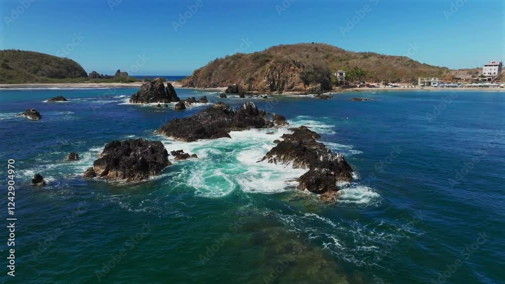 Waves Crashing On Rocks Near Playa la Morita In Tenacatita, Jalisco, Mexico. - aerial shot Waves Crashing On Rocks Near Playa la Morita In Tenacatita, Jalisco, Mexico. - aerial shot