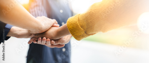 Panoramic teamwork business join hand together,Teamwork power,unity concept.group of friends put their hands together.Volunteer charity work.People joining for cooperation success business.