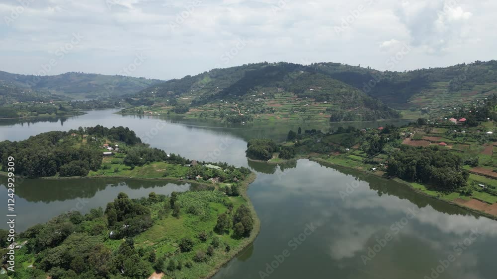 Uganda. Aerial view of Lake Bunyonyi, surrounded by lush green hills, small islands, and scattered settlements, creating a serene and picturesque landscape. Uganda. Africa. Uganda. Aerial view of Lake Bunyonyi, surrounded by lush green hills, small islands, and scattered settlements, creating a serene and picturesque landscape. Uganda. Africa.