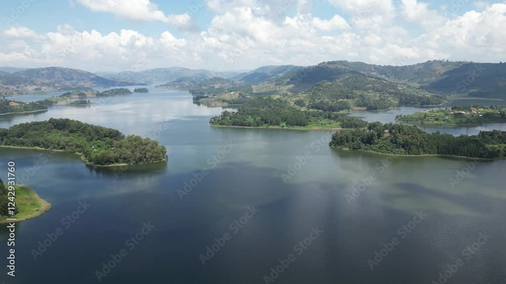 Uganda. Aerial view of Lake Bunyonyi, surrounded by lush green hills, small islands, and scattered settlements, creating a serene and picturesque landscape. Uganda. Africa. Uganda. Aerial view of Lake Bunyonyi, surrounded by lush green hills, small islands, and scattered settlements, creating a serene and picturesque landscape. Uganda. Africa.