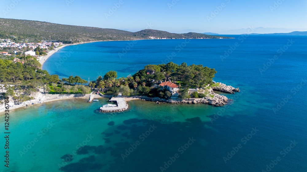 Manal Bay, which is connected to İzmir, is a peaceful and quiet resting area with its deep blue sea in Mordoğan Karaburun. Aerial view with drone. Izmir - Turkey