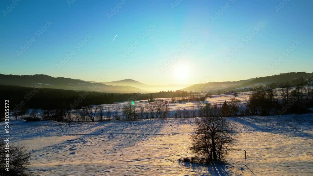 Drone flight towards the setting sun in a winter mountain scenery of Beskid Mountains - 4K Drone flight towards the setting sun in a winter mountain scenery of Beskid Mountains - 4K