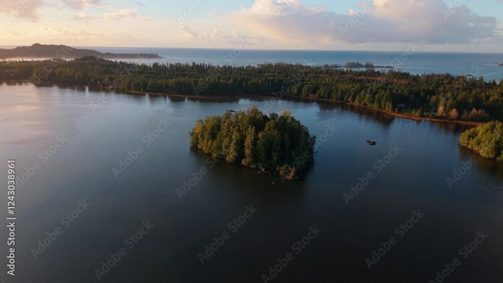 Drone shot of Tofino on Vancouver Island displaying autumn colors, rugged coastline, and ocean waves in a scenic aerial view. Drone shot of Tofino on Vancouver Island displaying autumn colors, rugged coastline, and ocean waves in a scenic aerial view.