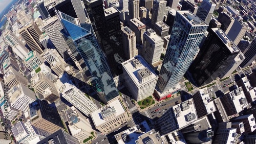 Comcast technology center and center city district are rotating, showcasing philadelphia's modern architectural landscape and urban density under a clear blue sky photo