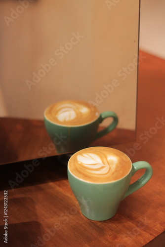 Green Coffee Cup Reflects in Mirror: Latte Art, Coffee, Reflection, Mug, Cafe, Beverage, Drink, Table, Hot Drink, Caffeine