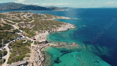 Scenic coastline drone shot of Tigania Beach in Sithonia Greece. Turquoise waters of Greek peninsula with tourists on vacation. photo