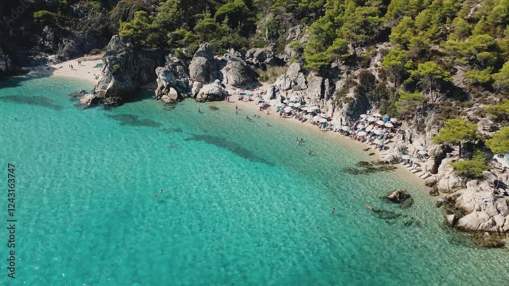 Aerial view of the famous Kavourotripes in Sithonia, Halkidiki. Paradise Beach with the amazing turquoise waters during Summer In Sithonia, chalkidiki, Greece Aerial view of the famous Kavourotripes in Sithonia, Halkidiki. Paradise Beach with the amazing turquoise waters during Summer In Sithonia, chalkidiki, Greece