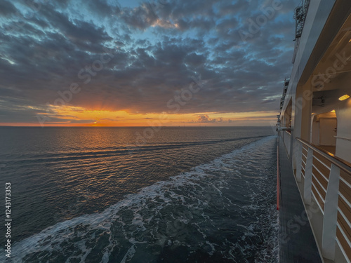 Breathtaking panoramic ocean views from outdoor deck of modern cruiseship cruise ship liner Queen Anne sailing at sea with blue sky and clouds photo