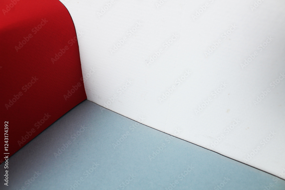 Obraz premium The corner is made of red, white and gray wall flowers. Color combination