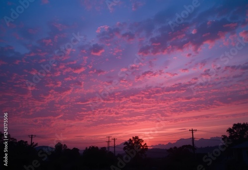 Obraz na płótnie A beautiful sunset with pink, purple, and pastel colors in the sky w salonie
