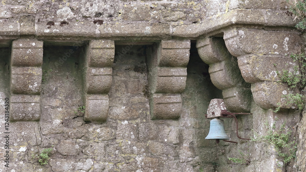 Αυτοκόλλητο Mont-Saint-Michel: rusty small bell among the corbels of a parapet wall, bulwark on the north slope at the foot of the refectory