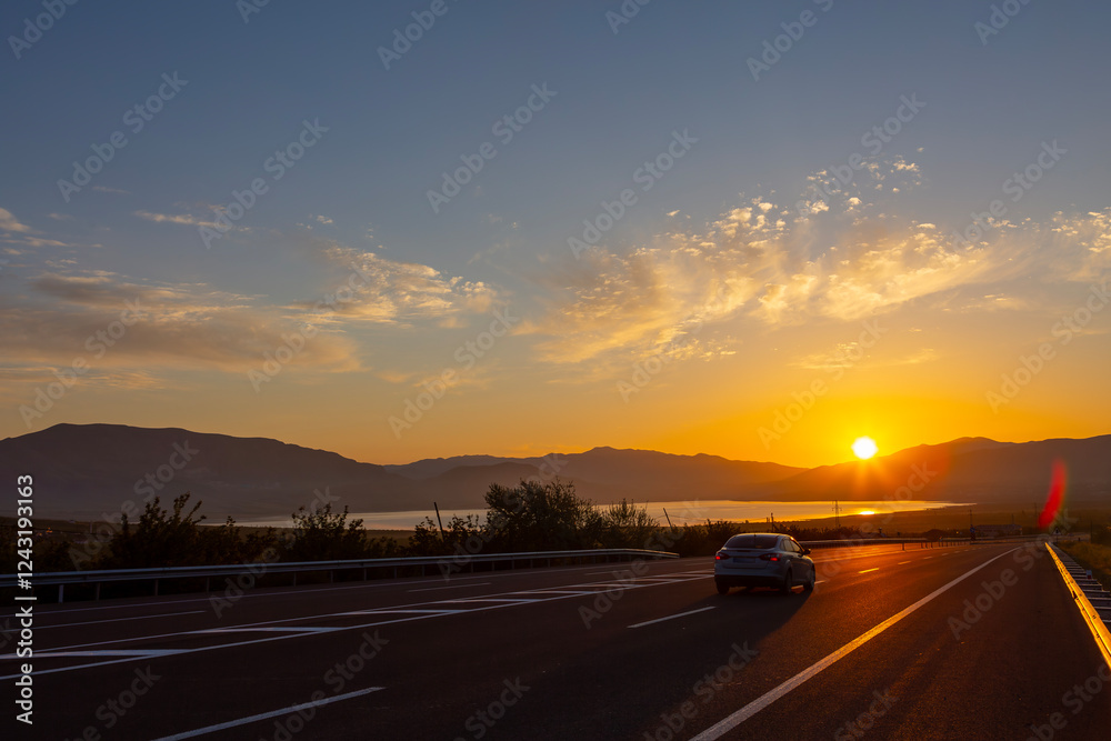 a road with a wonderful view at sunrise