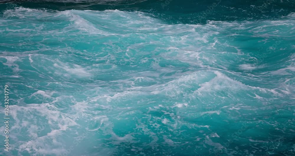 Sailing in the turquoise water of mediterranean sea or caribbean sea, nature landscape of ocean ripple waves and sunlight
