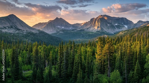 Majestic Mountain Landscape Surrounded by Lush Green Forest at Sunset in the Wilderness