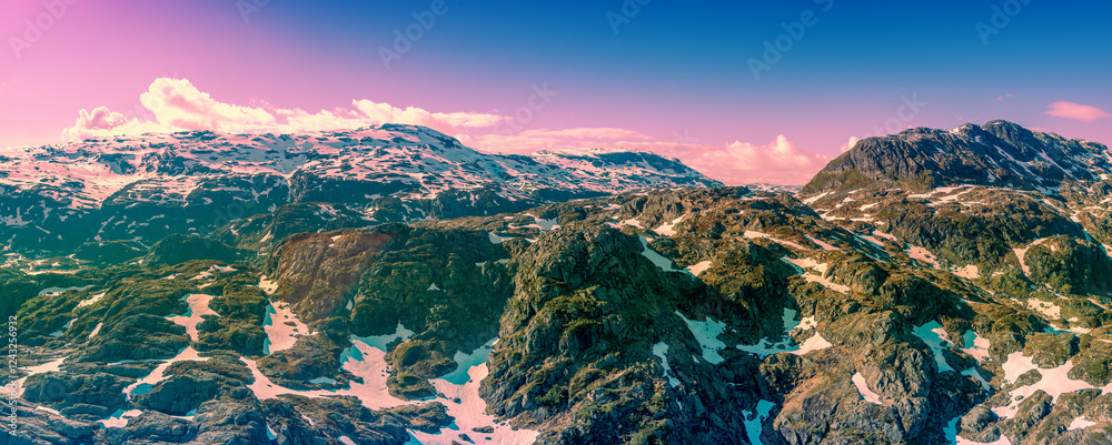 View from above of high mountains ridge in early summer. High mountains nature park in Sauda municipality. The beautiful nature of Norway, Europe