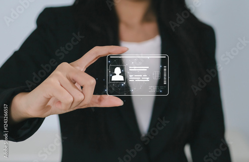 Close-up of woman holding ID card. Businesswoman's hand and digital ID card. Technology and innovation concept.