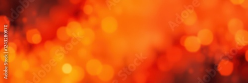 Bright orange and red bokeh lights create an abstract background representing warmth and energy in a vibrant atmosphere