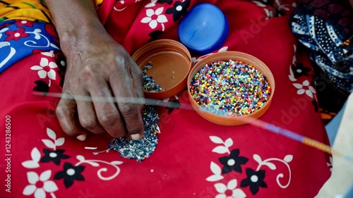 African artist handcrafting Maasai jewelry