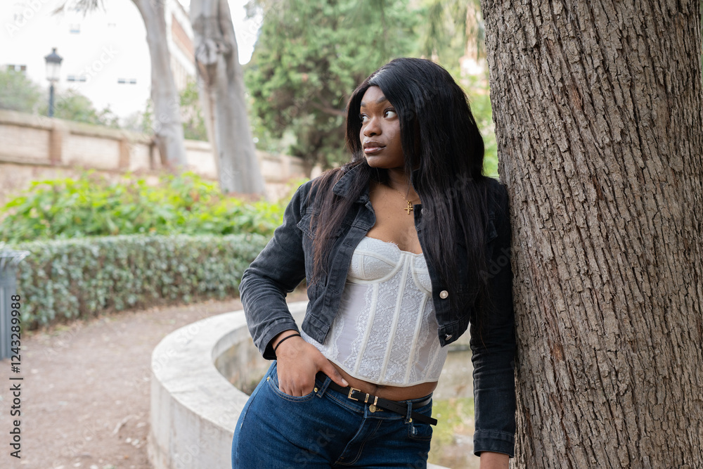 Young woman relaxing in a peaceful park setting Young woman relaxing in a peaceful park setting