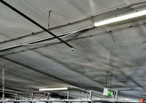signaling device for the occupancy of parking spaces in the parking garage at the airport or office shopping mall.  the occupancy sensor lights up a red light on the ceiling