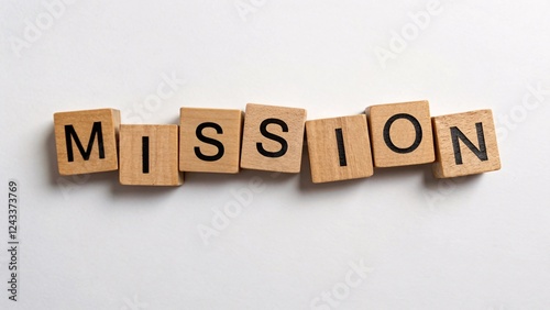Wooden blocks spelling out mission emphasizing creativity in business strategy and communication.