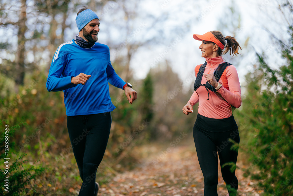 Happy Couple Running on a Forest Trail Happy Couple Running on a Forest Trail