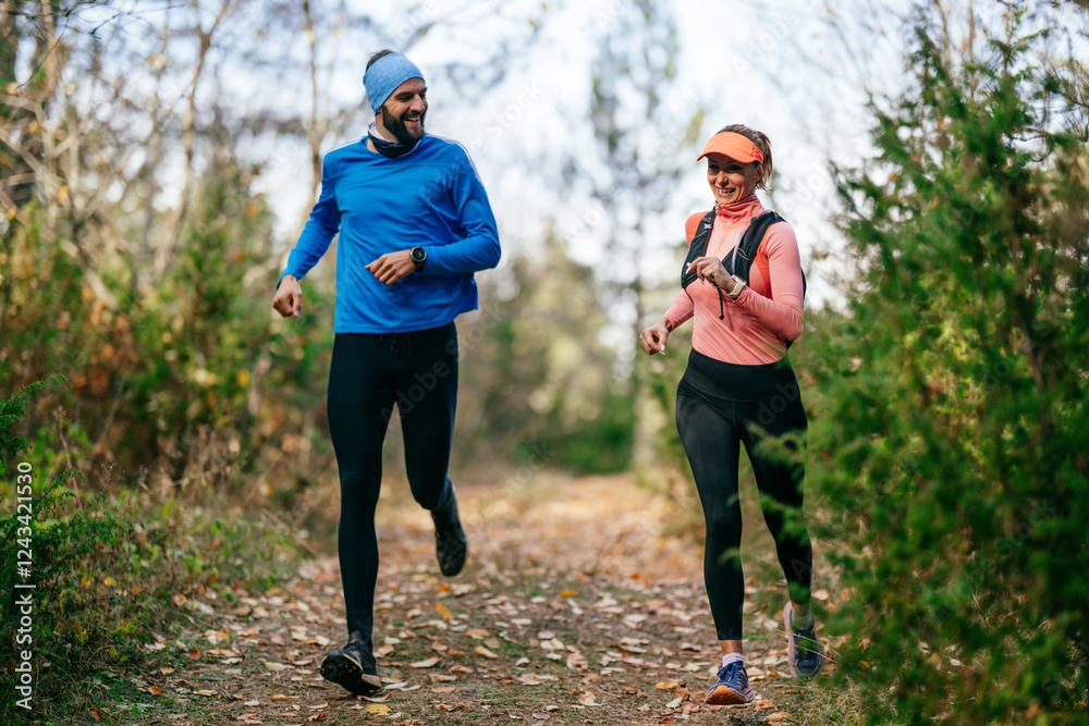 Happy Couple Running on a Forest Trail Happy Couple Running on a Forest Trail