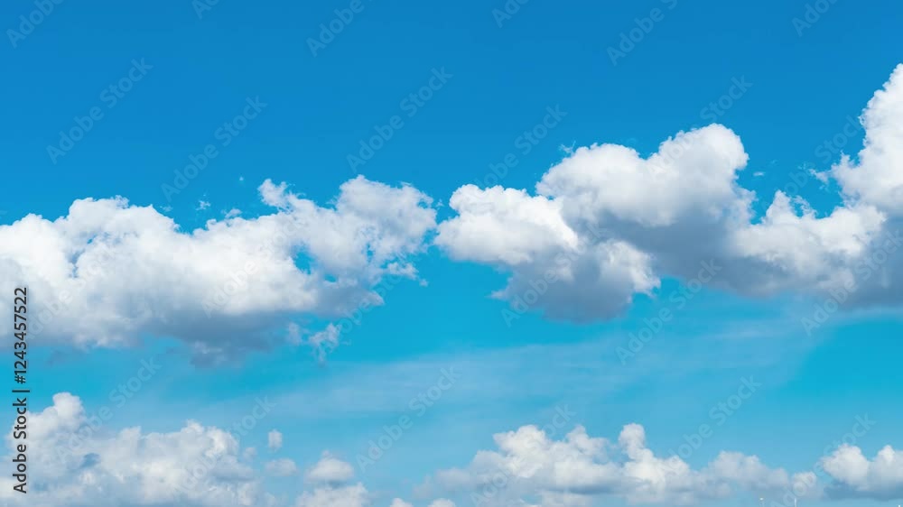 4k aerial video of bright blue sky with fluffy white clouds drifting over a serene landscape during a sunny day 4k aerial video of bright blue sky with fluffy white clouds drifting over a serene landscape during a sunny day