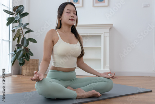 Teenage girls practicing yoga poses, trainer stretching muscles in the morning at home