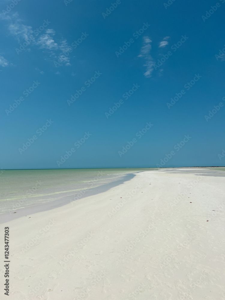 White sand beach with blue sky and no people White sand beach with blue sky and no people